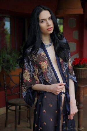 Beautiful teen with dark hair Dita V showcases her perfect pussy in the nude on picsofsex.com