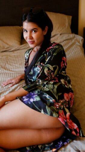 Asian amateur Lady Dee removes her floral print dress before having sex on picsofsex.com