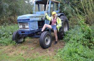 Mature amateur Barby Slut exposes herself on heavy equipment at a job site on picsofsex.com