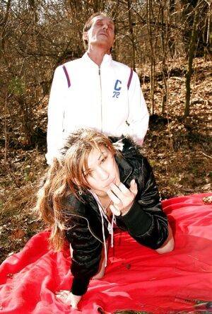 Cute teen babe Regina F gives a blowjob and gets nailed outdoor on picsofsex.com