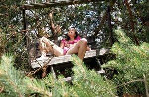 Teen babe Tamara F. spreading her pussy for solo play while outdoors on picsofsex.com