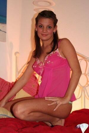 Katie shows off her new pink nightie on picsofsex.com