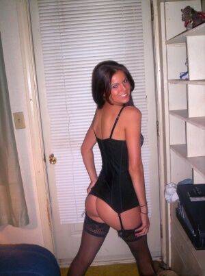 A very cute and sexy Alex in black lingerie and silky nylons on picsofsex.com