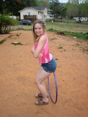 Petite teen Shelby plays around with a hoola hoop on picsofsex.com