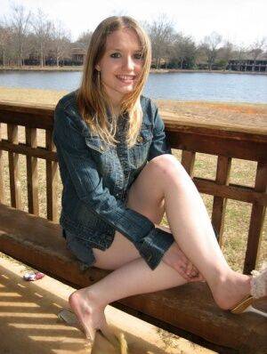 Cute slutty teen Shelby flashes her hard nipples at the lake in a public park on picsofsex.com