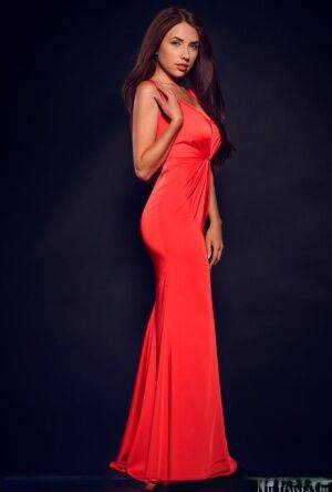 Young brunette Niemira releases her beautiful body from a red gown on picsofsex.com