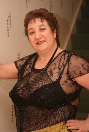 Older redhead Kinky Carol displays her plump figure in a crotchless stocking on picsofsex.com