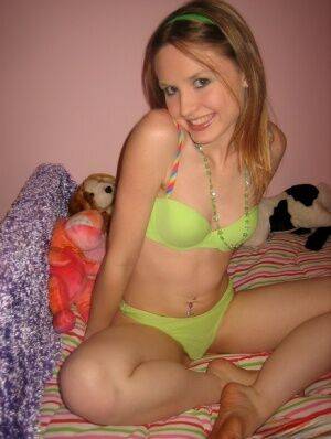 Tiny teen Shelby teases as she strips out of her skimpy matching bra and on picsofsex.com