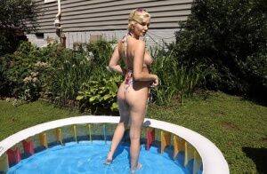 Blonde amateur Skye Blue dildos her pussy while in a backyard setting on picsofsex.com