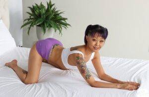 Tattooed Asian girl Saya Song has POV sex with a big white cock on picsofsex.com