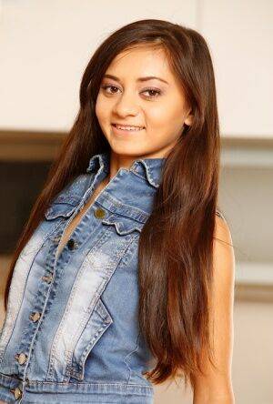 Cute teen Shrima Malati removes denim apparel before fingering her tight slit on picsofsex.com