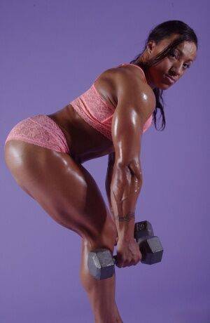 Black bodybuilder Karen Garrett displays her muscled physique on picsofsex.com