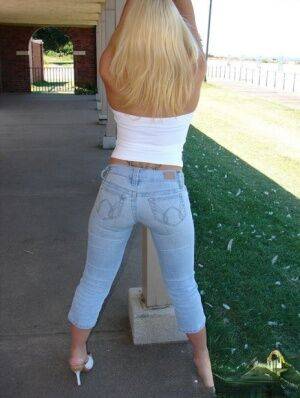 Blonde amateur Karen exposes her lace thong while outdoors in faded jeans on picsofsex.com