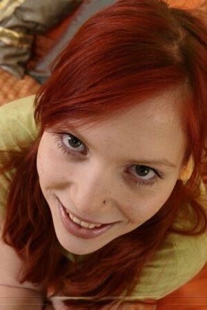 Young redhead has sexual intercourse with an older man in bumble bee socks on picsofsex.com