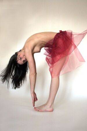Dark haired teen Katya N strikes confident nude poses in a tutu on picsofsex.com