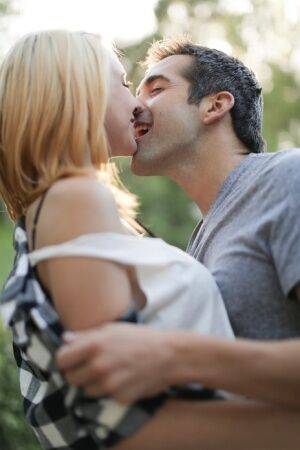 Blonde girl Cece Capella and Donnie Rock kiss with their clothes on outdoors on picsofsex.com