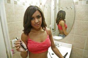 Amateur black babe Nicole flaunting big natural saggy tits in bathroom on picsofsex.com