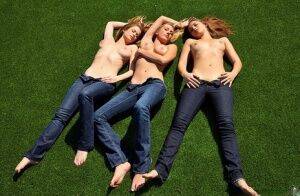 3 topless girls pull their blue jeans down over their bare asses on the lawn on picsofsex.com