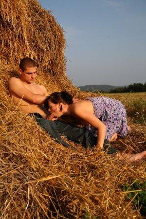 Behind a large bale of hay, these teens are out of sight and able to do on picsofsex.com