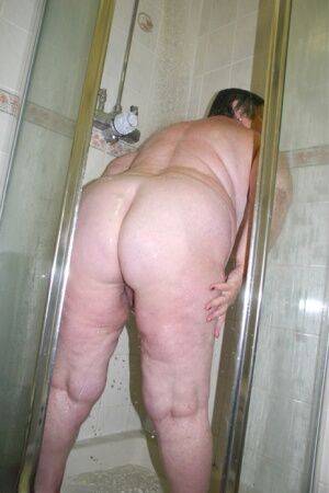 Obese granny Grandma Libby fondles her naked body while taking a shower on picsofsex.com