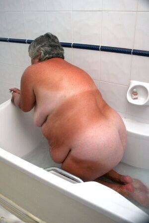 Obese old woman Grandma Libby gets completely naked while having a bath on picsofsex.com