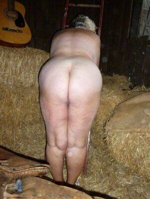 Fat oma Grandma Libby gets naked in a barn while playing acoustic guitar on picsofsex.com