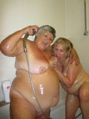 Grandma Libby and her lesbian lover wash each other during a shower on picsofsex.com