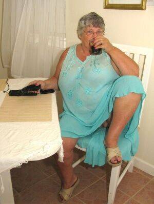 Obese amateur Grandma Libby bares her tan lined body after a phone sex on picsofsex.com