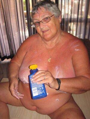 Obese old woman Grandma Libby covers her naked body in lotion on picsofsex.com