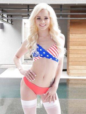 Blonde spinner Elsa Jean stripping off USA bikini top in white stockings - Usa on picsofsex.com