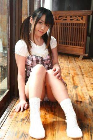 Cute Asian schoolgirl Arisa Suzuki shows her bush in white socks only on picsofsex.com