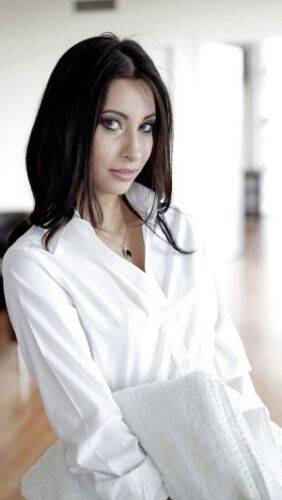 Brunette babe Jade Jantzen posing fully clothed in white blouse and skirt on picsofsex.com