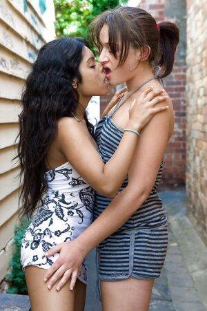 Indian lesbian Kiki tongue kissing white girlfriend Lou-Ellyn outdoors - India on picsofsex.com