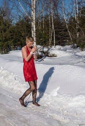 White female is toed up and forced to stand and kneel in snow on picsofsex.com