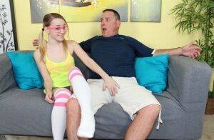 Geeky blonde teen wanking a massive white bone on the sofa on picsofsex.com