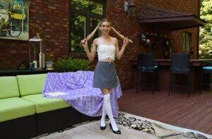 Teen amateur Jessica Marie masturbates while wearing white over the knee socks on picsofsex.com