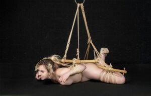 Naked white girl Kama Medea is suspended by ropes while anally hooked on picsofsex.com