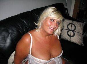 Overweight blonde Chrissy Uk exposes herself in white lingerie and nylons on picsofsex.com