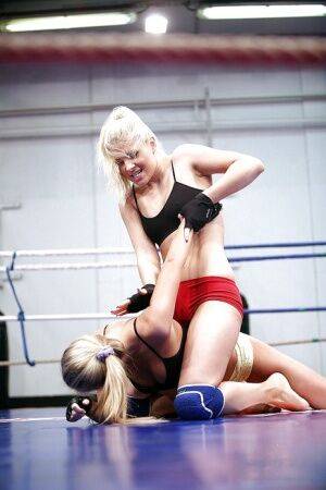 Gorgeous sporty lesbians fighting and pleasuring each other in the ring on picsofsex.com