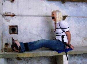 British woman is tied up and gagged in blue jeans and a white shirt - Britain on picsofsex.com