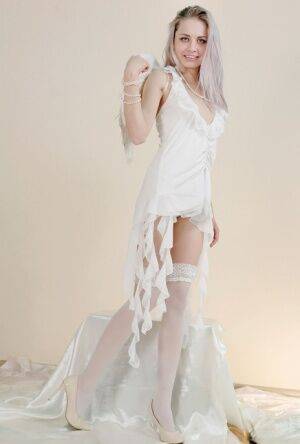 Egida looks so hot in her white angel costume and even more when she undresses on picsofsex.com