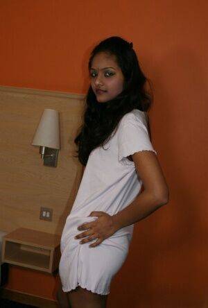 Indian female Divya lifts up a white dress to expose her vagina - India on picsofsex.com