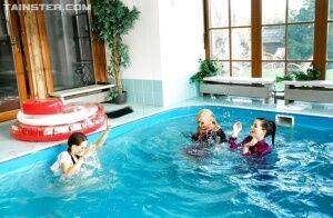 Playful fetish ladies have some fully clothed fun in the pool on picsofsex.com