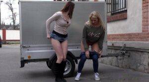 Katy Sky and Victoria Daniels duck behind a trailer for a much needed piss on picsofsex.com