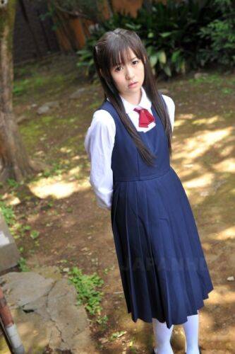 Charming Japanese babe posing in her cute school outfit in the garden - Japan on picsofsex.com