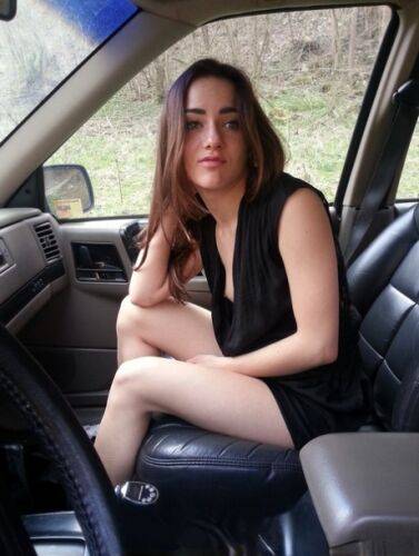 Horny girl Kasia Kelly takes selfies while playing with her pussy inside a car on picsofsex.com