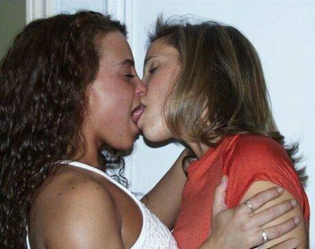 Amateur chicks tongue kiss before undressing for a lesbian experience on picsofsex.com