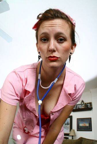 Salacious mature nurse in fancy nylons undressing and teasing her twat on picsofsex.com