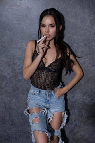 Petite girl Dominique Gabrielle works free of ripped jeans to pose nude on picsofsex.com