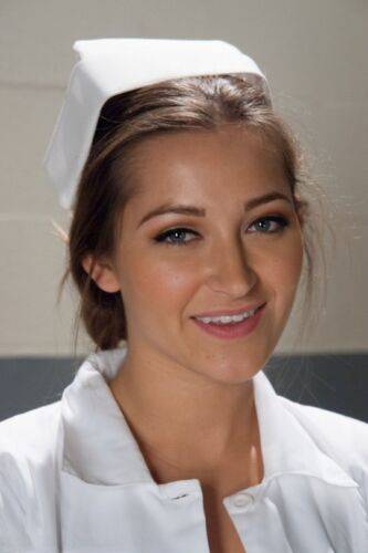 Gorgeous nurse with a nice butt Dani Daniels strips and poses in high heels on picsofsex.com